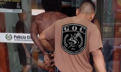 Homem preso por guardas na Francisco Bicalho
