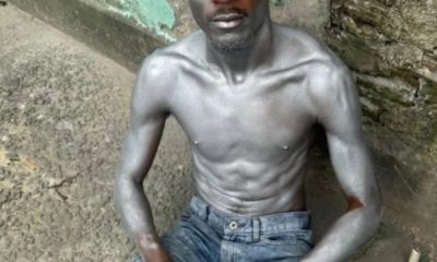 Homem escala cruz e picha fachada da igreja na Ilha do Governador (Foto: Giovanna Faria/ Super Rádio Tupi)