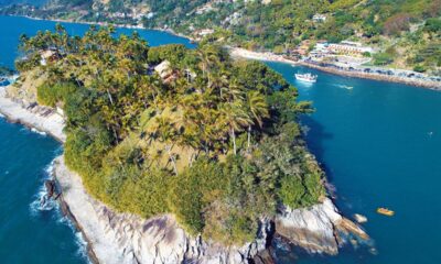 A ilha paulista onde a Mata Atlântica abraça praias de alguns dos cenários mais impressionantes do país