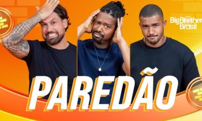 Três homens com expressões tensas sob o letreiro "PAREDÃO" e logo Big Brother Brasil.