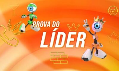 Ilustração com dois robôs do BBB, texto 'Prova do Líder', coroa e símbolos sobre fundo laranja.