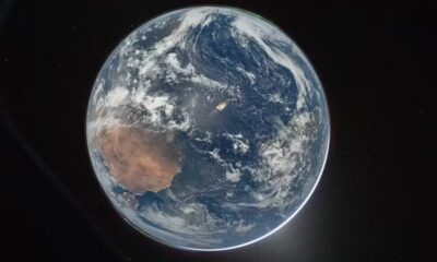 Planeta Terra visto do espaço, com rastro de luz de um lançamento na superfície. Foto: NASA/Reid Wiseman