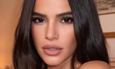 Rosto de Bruna Marquezine em close-up, com longos cabelos escuros e maquiagem destacada.