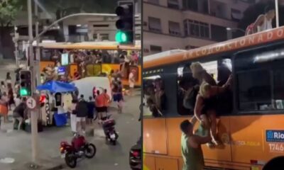 Pessoas superlotam ônibus, algumas pulando janelas, outras no teto, em rua de Copacabana