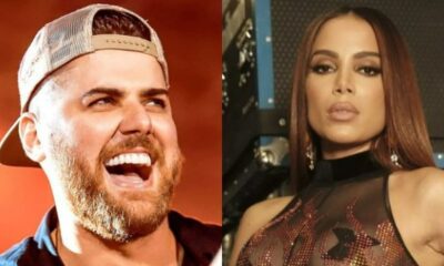 Zé Neto, com barba e boné, sorri; Anitta, de cabelo castanho e semblante sério