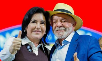 Lula de chapéu e Simone Tebet, ambos sorrindo e fazendo sinal de positivo