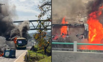 Dois ônibus em chamas: um com fumaça preta, outro envolto em fogo intenso na rodovia