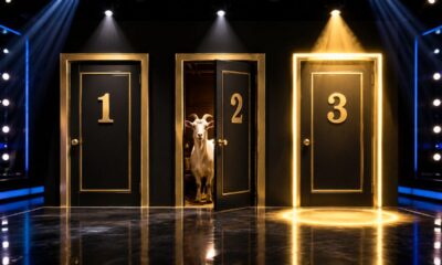 Três portas numeradas 1, 2 e 3 em um palco iluminado de programa de TV. A Porta 2 está entreaberta revelando uma cabra, enquanto a Porta 3 aparece fechada e destacada por luz dourada.