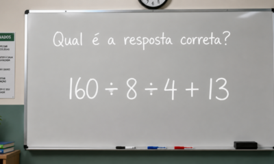 Quadro branco em uma sala de aula com a frase “Qual é a resposta correta?” e a expressão matemática 160 ÷ 8 ÷ 4 + 13 escrita em destaque.