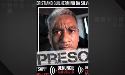 Rosto de homem sério, Cristiano Guilhermino da Silva, com os dizeres 'PRESO' e 'DENUNCIE'