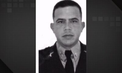 Retrato em preto e branco do policial militar Adriano Henrique Jardim da Silva em uniforme