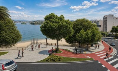 Vista aérea de orla urbana com praia, baía, ciclovia vermelha, calçadão e pessoas