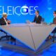 Lula, com chapéu, e dois jornalistas em estúdio de TV, com 'ELEICOES' ao fundo