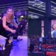 Mulher em bicicleta ergométrica e projeção de Vini Jr. em tela grande na academia