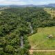 Herdeiro recebe terreno rural de 12 hectares avaliado em R$ 600 mil, contrata projeto para construir a casa da família e descobre que 80% da área está em preservação permanente e nada pode ser erguido ali