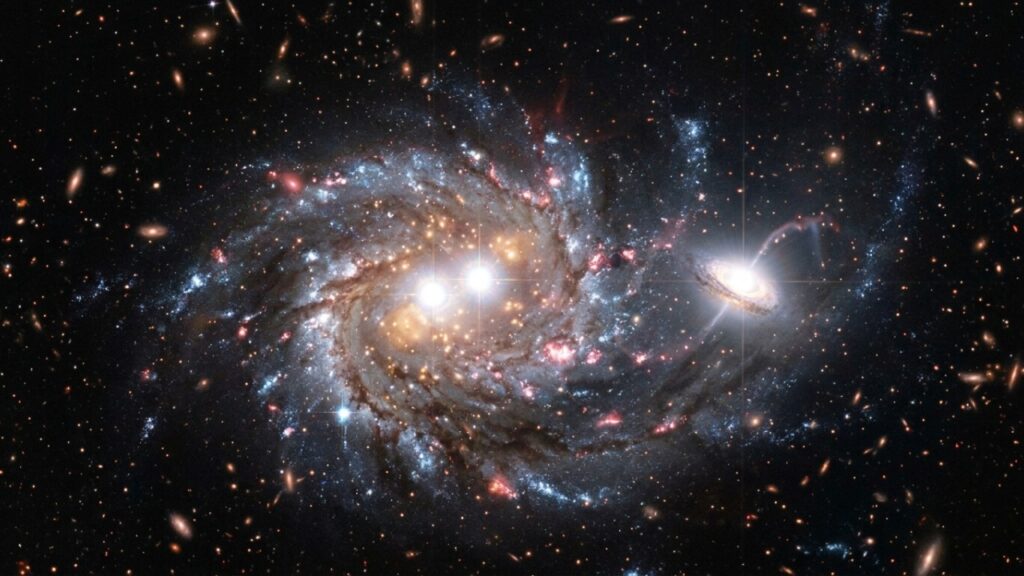 Astrônomos encontram trio de buracos negros massivos em galáxia a 12,5 bilhões de anos-luz, e dois deles estão separados por apenas 620 anos-luz