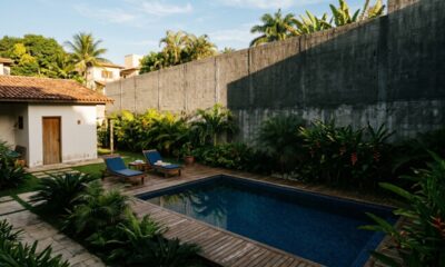 Vizinho ergue muro de 4 metros na divisa para tirar o sol da piscina do lado após briga por festas até as 23h, perde ação por abuso de direito e é condenado a demolir com multa de R$ 1.200 por dia de atraso