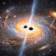 Astrônomos encontram trio de buracos negros massivos em galáxia a 12,5 bilhões de anos-luz, e dois deles estão separados por apenas 620 anos-luz