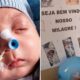 Bebê Noah com sonda no nariz e cartaz "Seja Bem Vindo Nosso Milagre!" com fotos