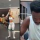 Academia movimentada com pessoas, recortes de atletas na parede e Vini Jr. em close, olhando para baixo