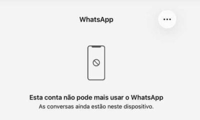 Tela do WhatsApp com mensagem de conta bloqueada e ícone de celular proibido