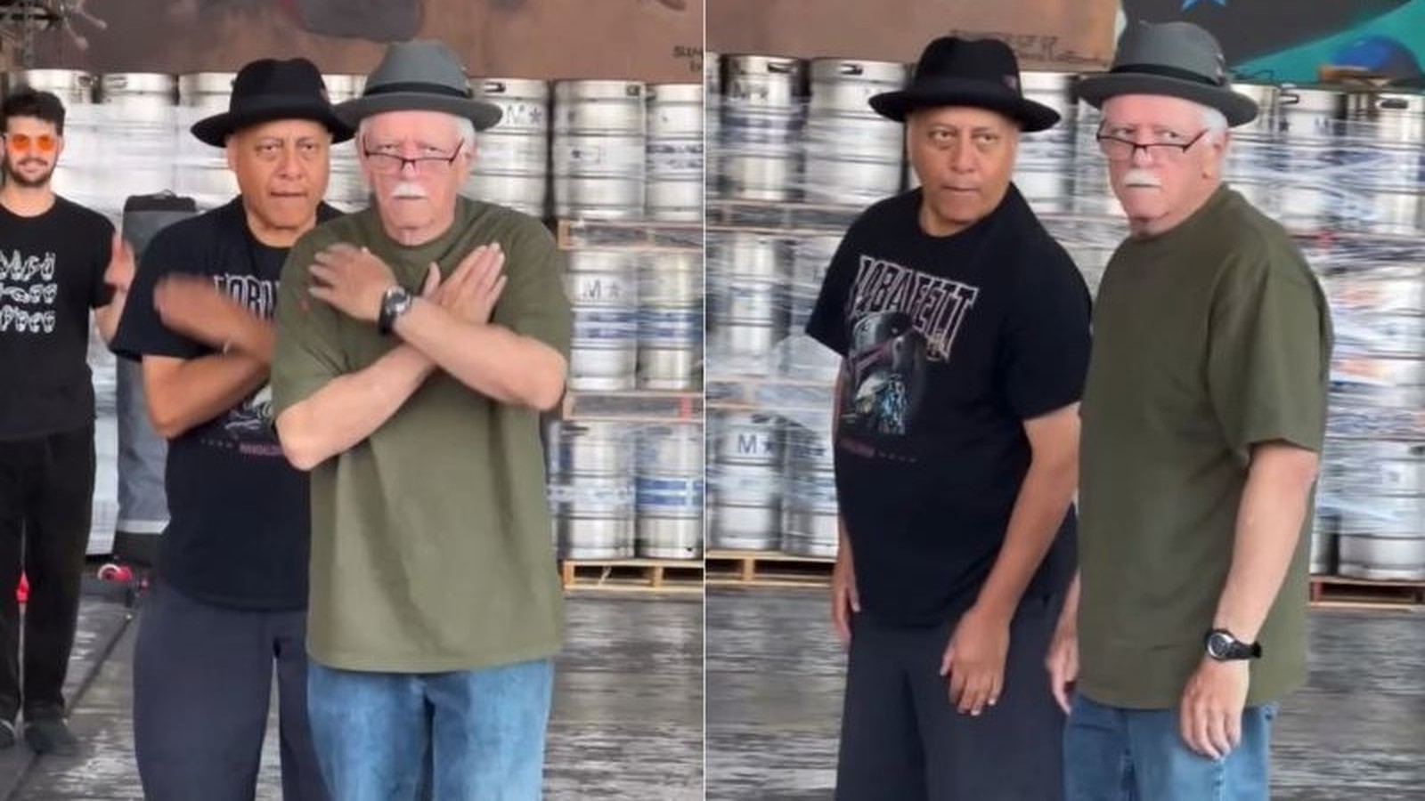 Dois dançarinos idosos posam em galpão com barris de cerveja ao fundo