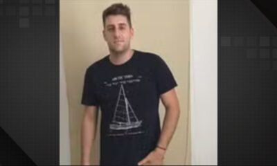 Homem jovem, Gabriel Dias Fernandes, cabelo e barba escura, vestindo camiseta preta com estampa de barco