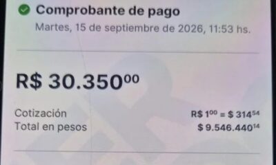 Tela de celular com comprovante de pagamento de R$ 30.350 e detalhes de câmbio