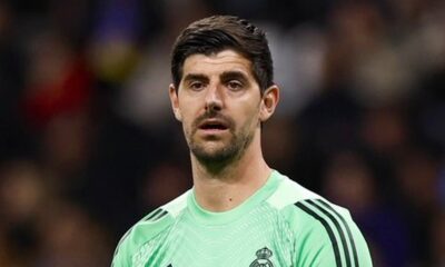 Thibaut Courtois, goleiro do Real Madrid, em close-up, vestindo camisa verde