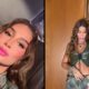 Mulher (Bianca Andrade) em split, selfie com maquiagem rosa e corpo em top verde ajustando calça