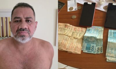Homem sem camisa, dinheiro em notas de cinquenta e cem reais, celulares, moedas e documentos