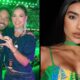 Homem e mulher fazem coração com as mãos, ao lado de mulher de cabelo escuro e top colorido