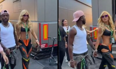 Vini Jr. e Virginia Fonseca de mãos dadas no paddock da Fórmula 1