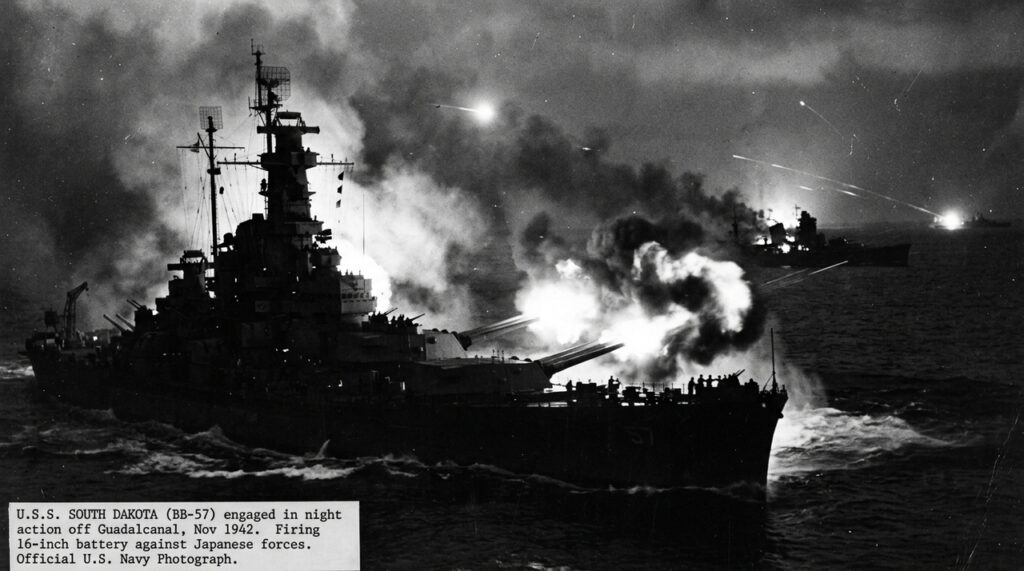 O South Dakota realizou dois ou três salvos contra um navio japonês antes de concentrar o fogo no Kirishima, contra o qual disparou cinco salvos até perder o controle dos sistemas de direção de tiro