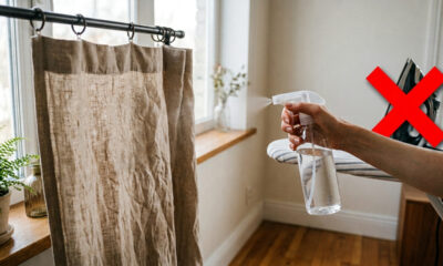 Sem tirar do varão, nem usar ferro de passar: a melhor forma de desamassar cortinas de linho borrifando álcool 70% diluído em água no tecido