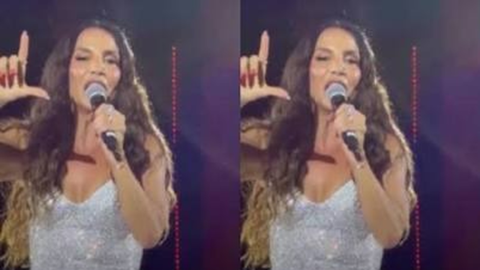 Ivete Sangalo com microfone, mão esquerda em 'L', cantando em palco iluminado