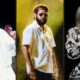 Três cantores no palco: homem sorrindo, homem com barba e óculos, e mulher com cabelo branco