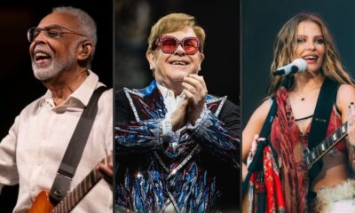 Três artistas em close-up: homem com barba e guitarra, homem de óculos e jaqueta, mulher com guitarra e microfone