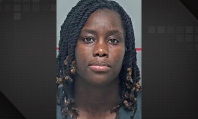 Mugshot de Aminata Amina Seck, mulher negra com tranças escuras e expressão neutra