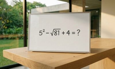Expressão matemática 5² − √81 + 4 escrita em um quadro branco, com ponto de interrogação no lugar da resposta.