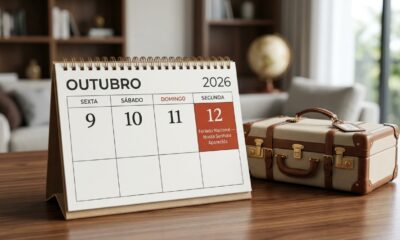 Calendário de outubro de 2026 com os dias 10, 11 e 12 destacados e uma mala de viagem ao lado.