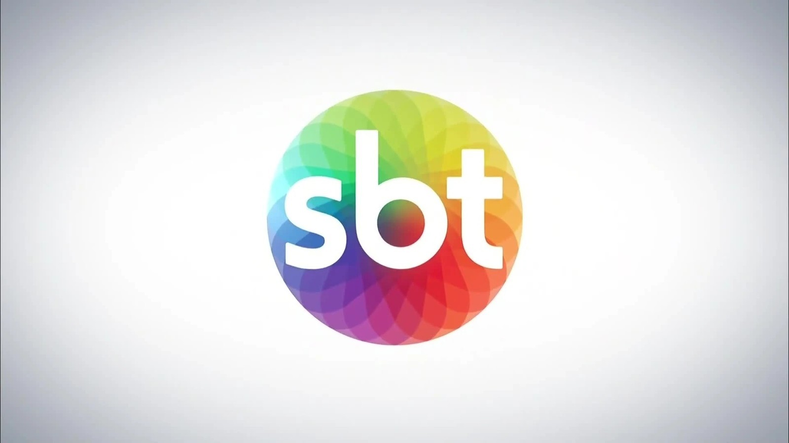 Logo da emissora SBT, com letras brancas dentro de um círculo colorido e vibrante