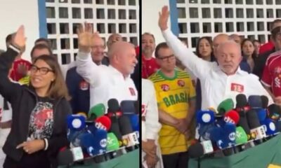 Lula e Janja acenam em coletiva com número 13 em camisas e microfones