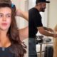 Franciny Ehlke de bobes no cabelo e grávida com maquiador aplicando produto na barriga