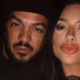 Close-up de Belo, com barba e boné, e Rayane Figliuzzi, com lábios marcantes