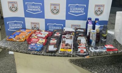 Produtos furtados: chocolates, embutidos, higiene pessoal sobre balcão com logo Segurança Presente