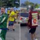 Homem em agasalho verde puxa corrente presa a outro homem com camisa "LULA 13" nas costas