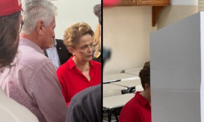Dilma Rousseff, de camisa vermelha, vota em cabine eleitoral em Belo Horizonte