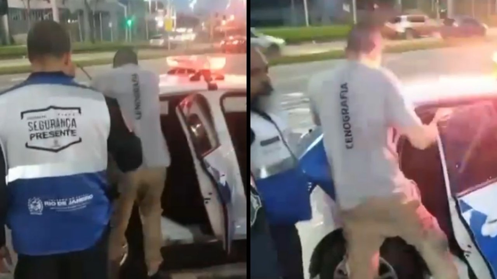 Homem com camiseta "CENOGRAFIA" sendo colocado em carro de polícia por agente "SEGURANÇA PRESENTE" à noite