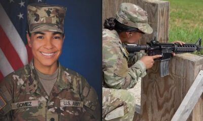 Mulher militar, nome "GOMEZ", sorrindo e atirando com fuzil em campo de treinamento